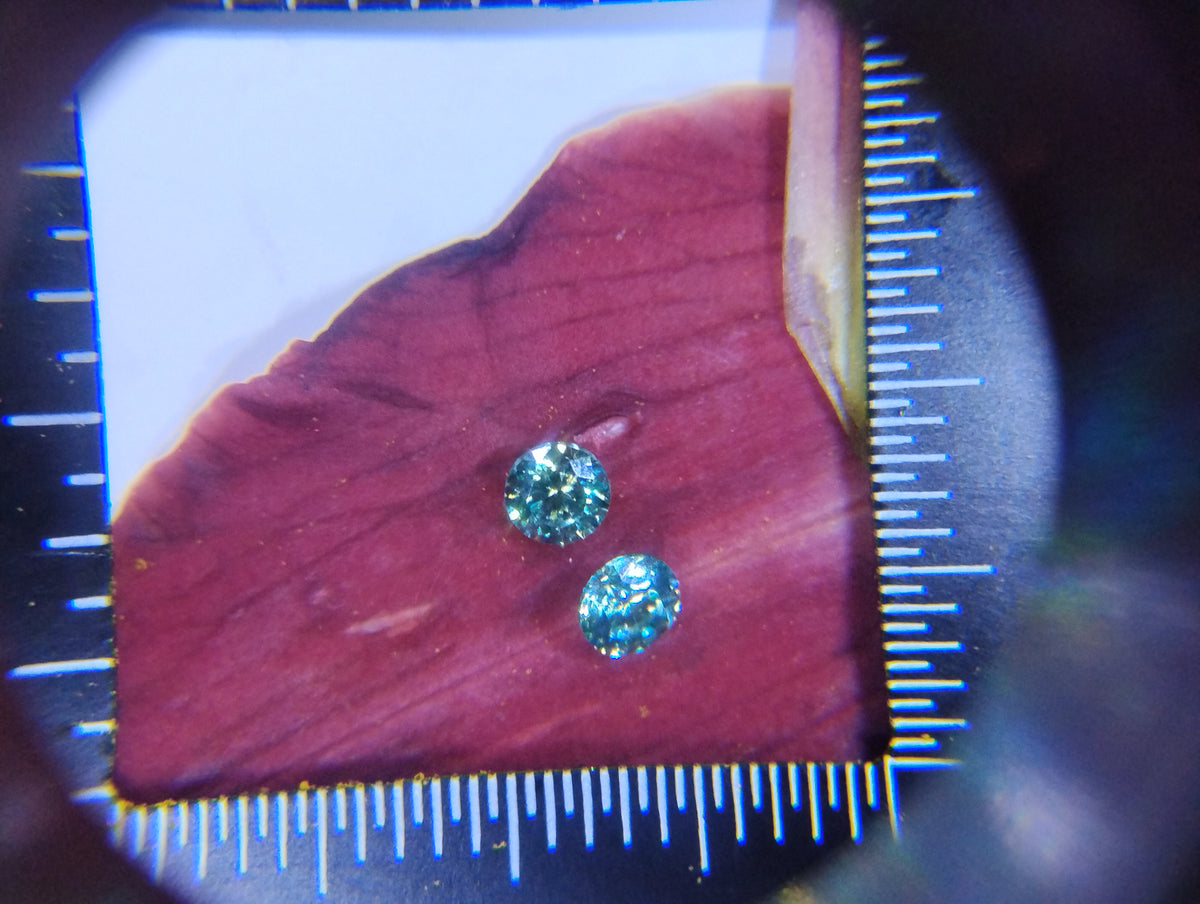 14k gold filled stud earrings with 3mm light blue lab moissanite gemstones, featuring a simple and elegant design.