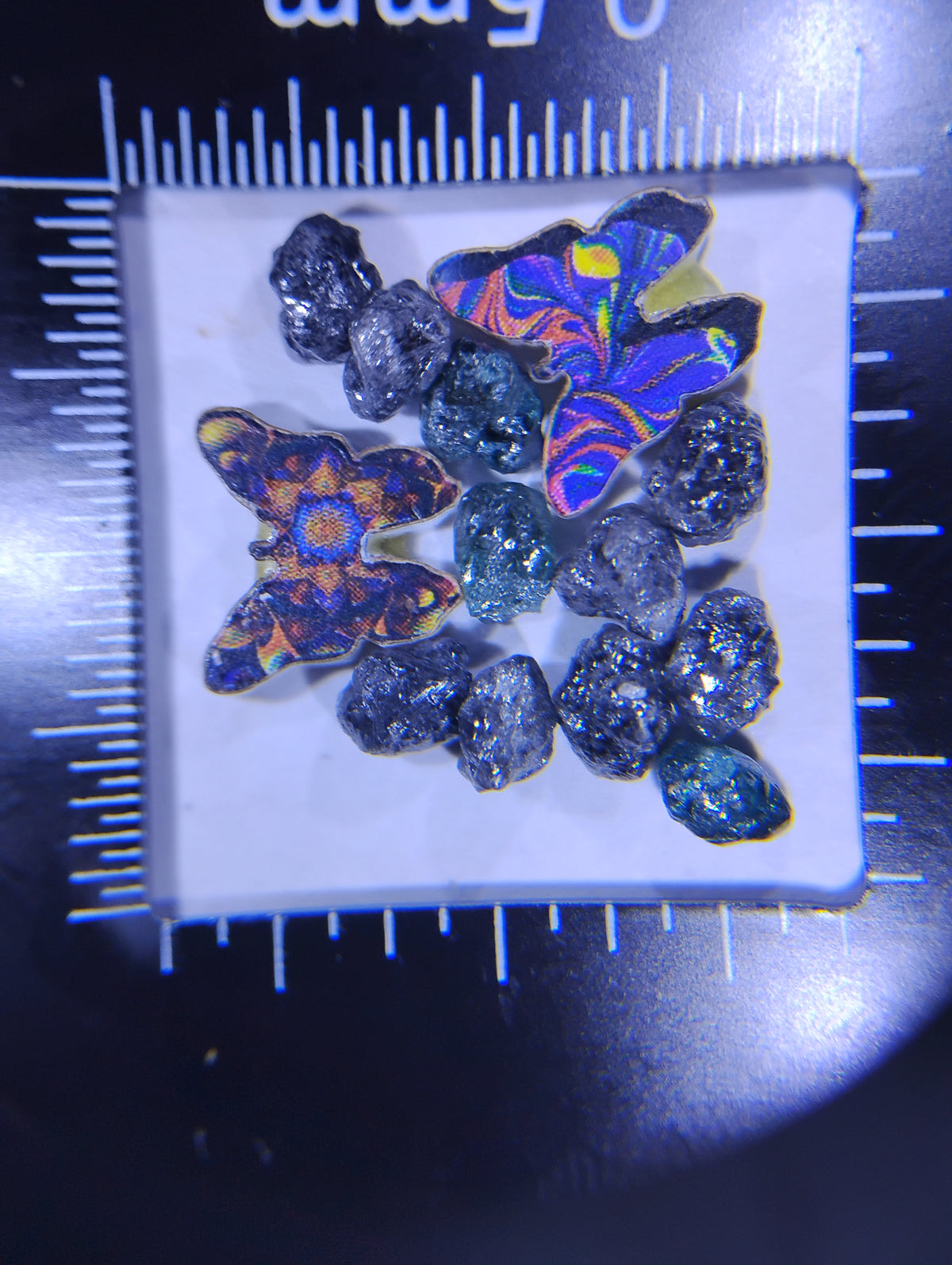 Uncut natural black rough diamonds in a jewelry setting, showcasing their rugged texture and raw beauty, by RoughDiamondsByMr.