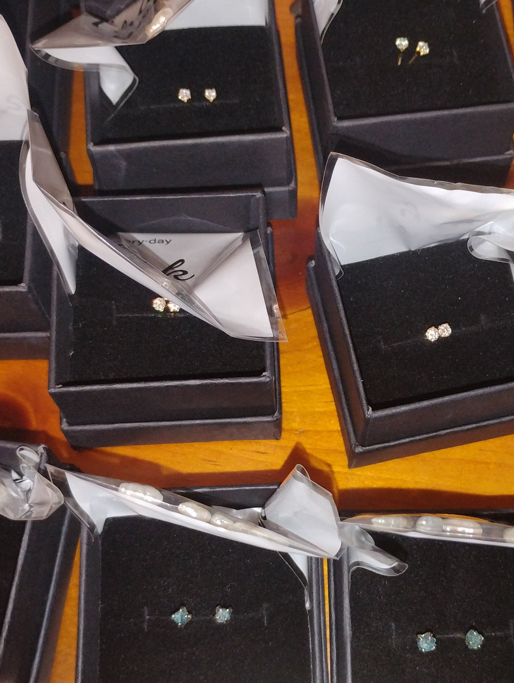 14k gold filled stud earrings with 3mm lab moissanite gemstones in four colors, from RoughDiamondsByMr, shown in the image.