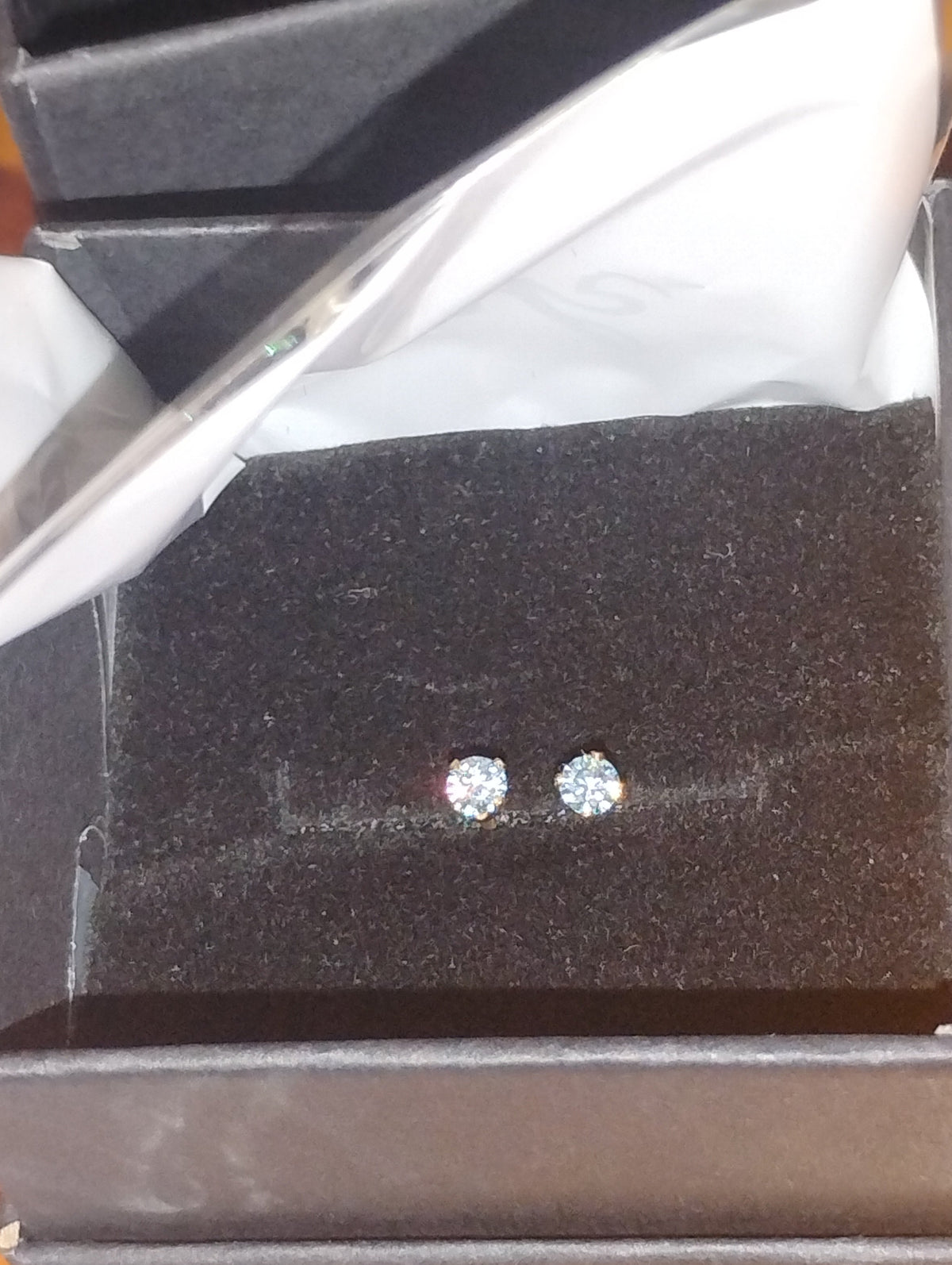 14k gold filled stud earrings with 3mm light blue lab moissanite gemstones, featuring a simple and elegant design.