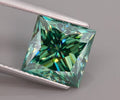 Sterling silver stud earrings with 5.5mm green lab moissanite and 0.5ct natural blue rough diamond, from RoughDiamondsByMr.